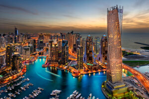 Dubai Marina from a high view showing the boats, sea, and the city scape.